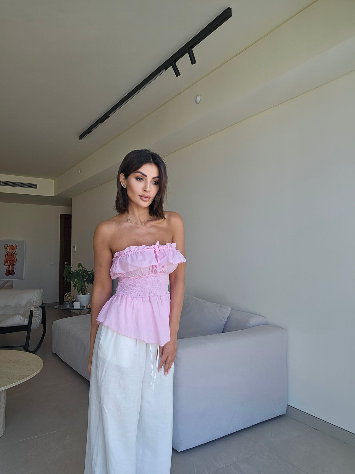 Off-the-shoulder strapless smocked peplum top