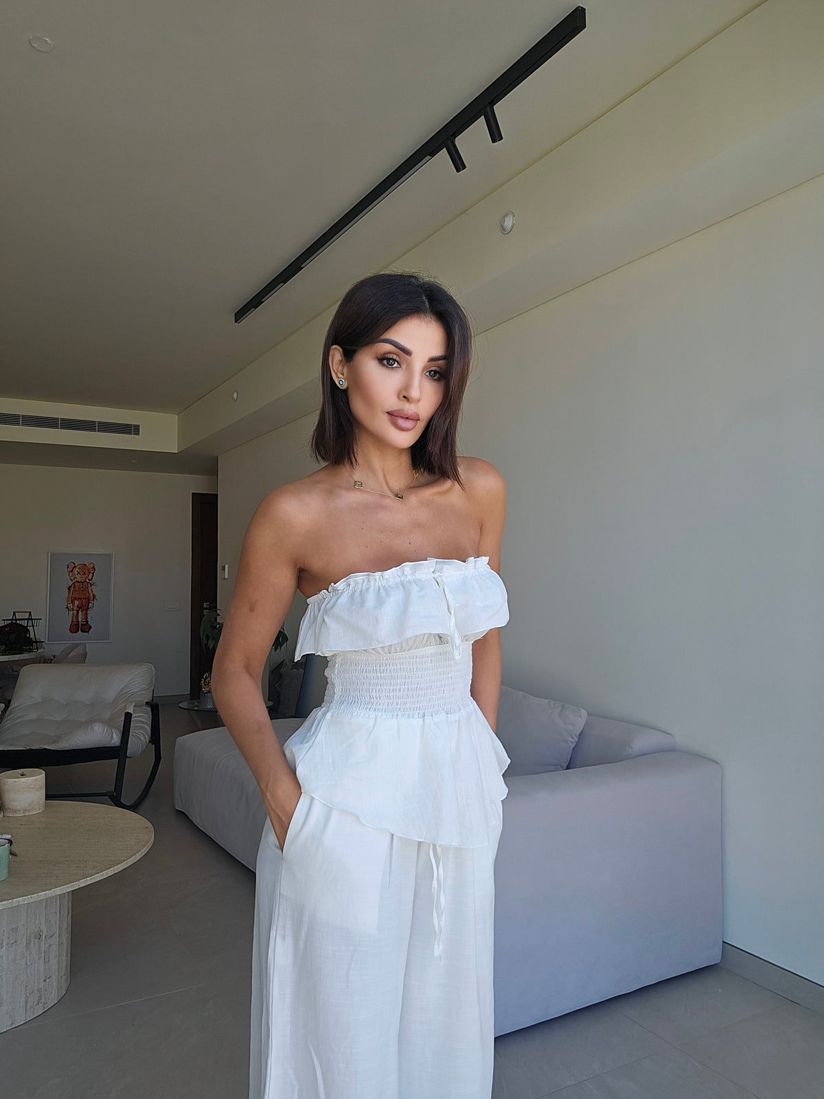Off-the-shoulder strapless smocked peplum top
