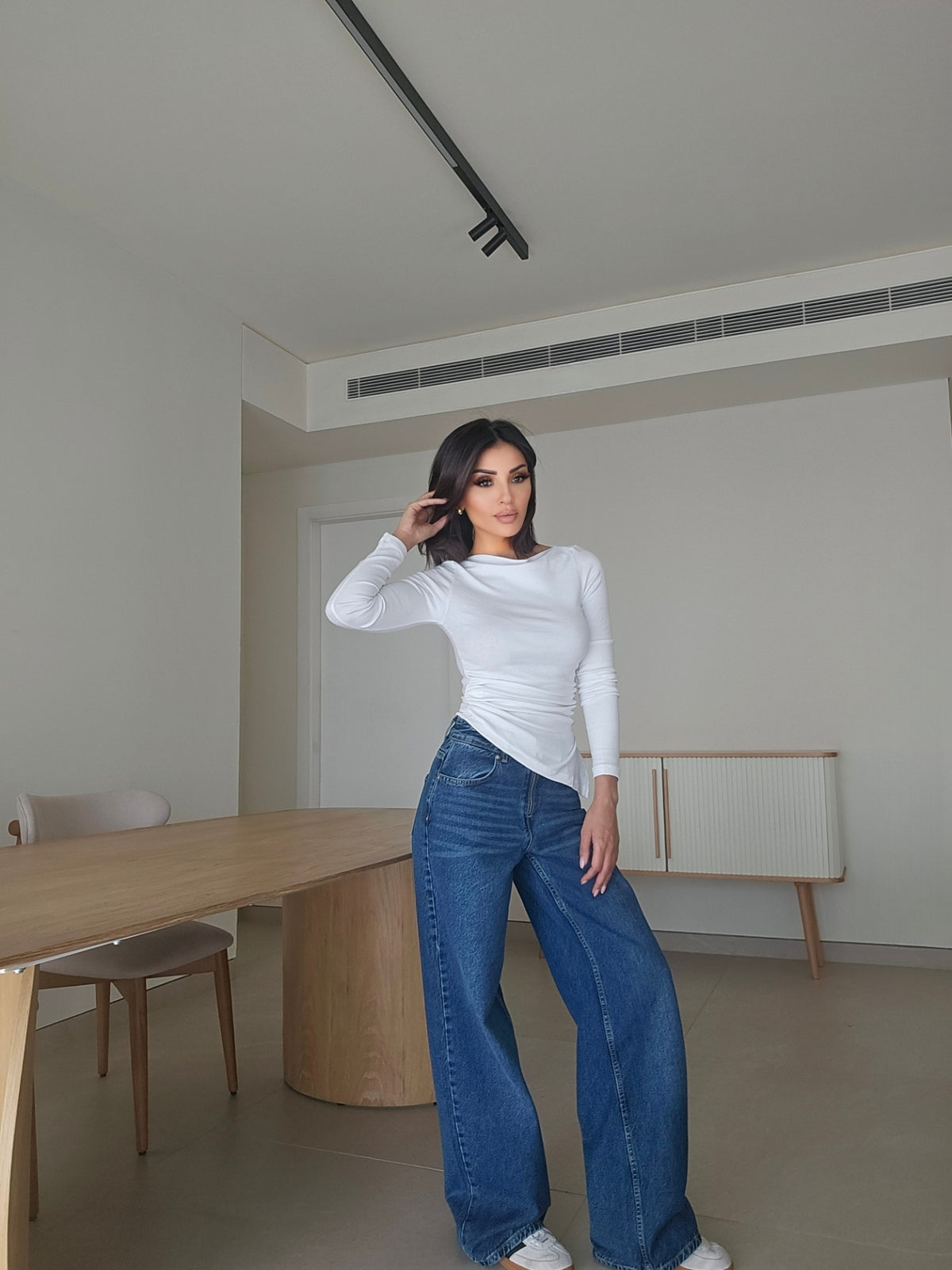 Asymmetric long-sleeve side-cinched boatneck cotton top