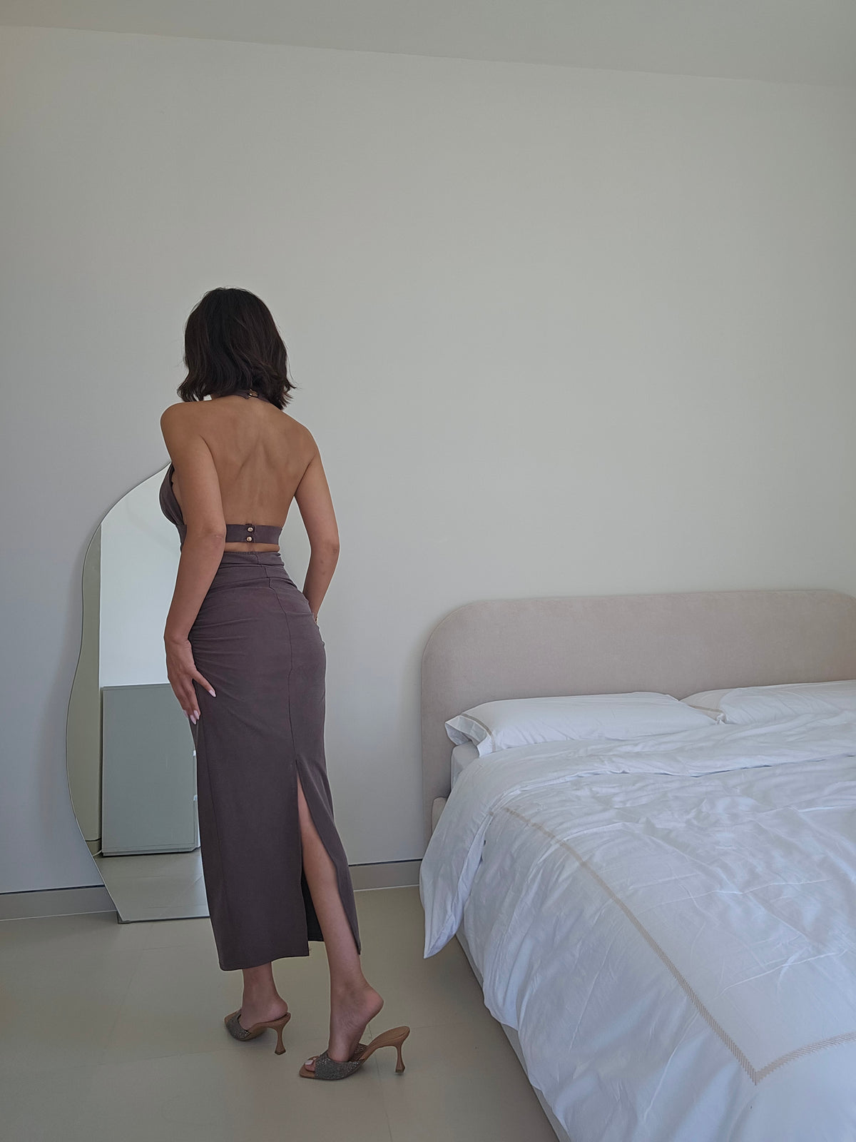 Ruched halter maxi dress with a gold hardware detail