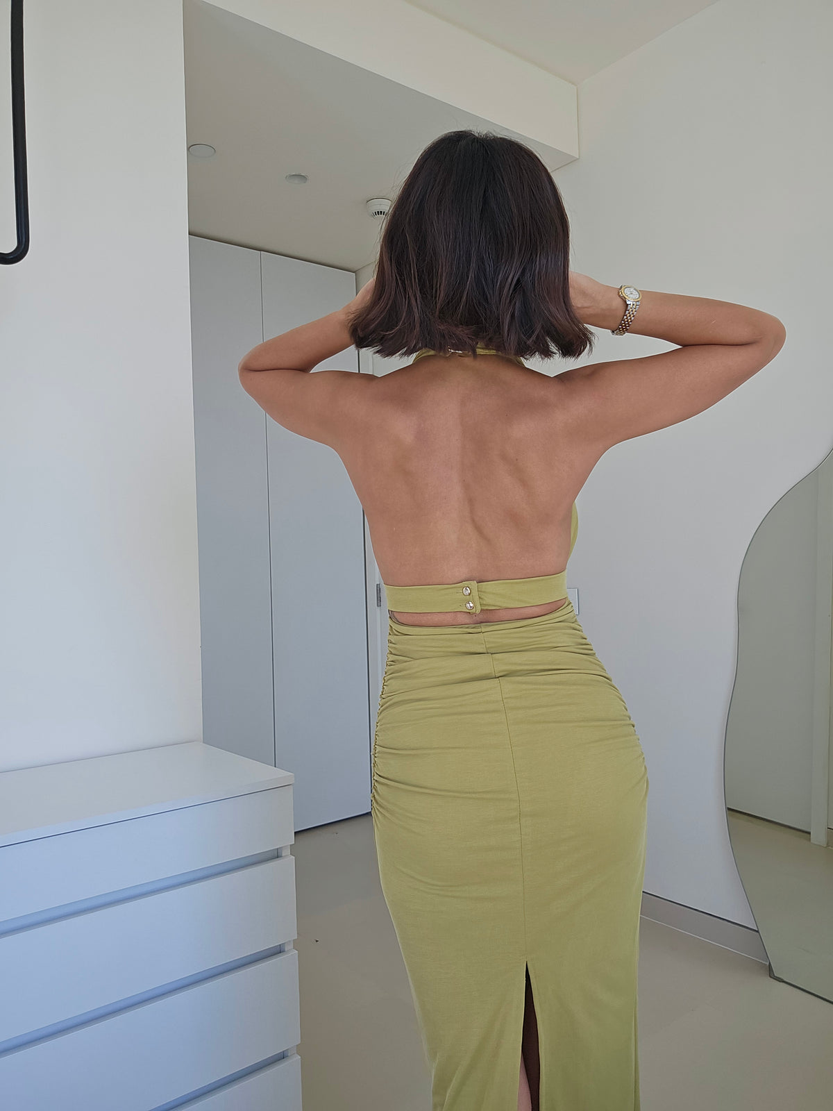 Ruched halter maxi dress with a gold hardware detail