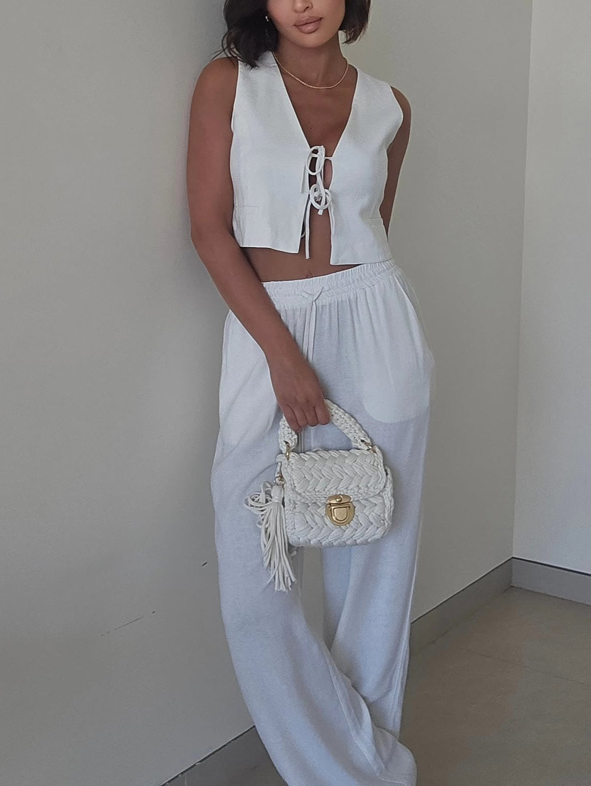 White linen tie-front vest and wide-leg pants set